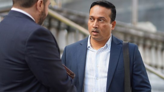 Four individuals have been charged by ASIC for a market manipulation scheme, including Syed Yusuf who was seen leaving the Downing Centre Courthouse. 