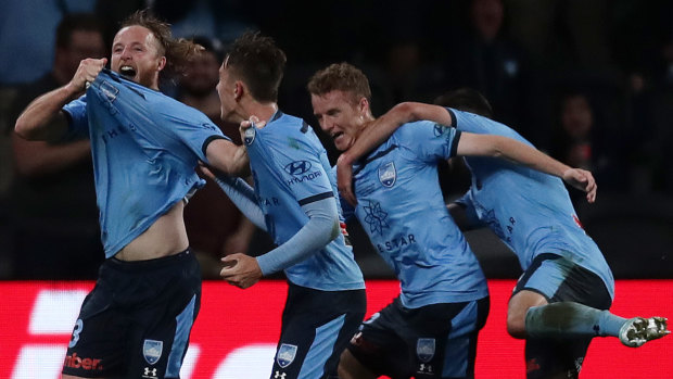 Winner's chest: Rhyan Grant scores the match winner for Sydney FC in the grand final. 