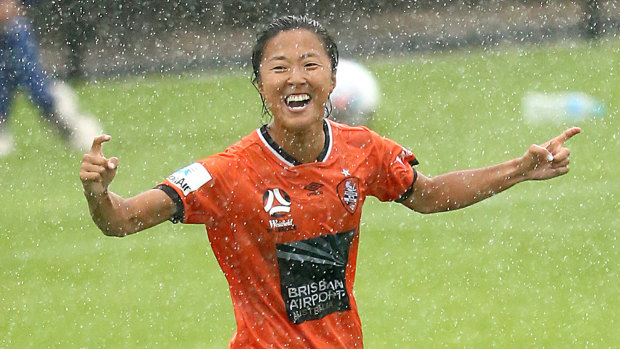Raining goals: Yuki Nagasato celebrates after scoring for Brisbane.