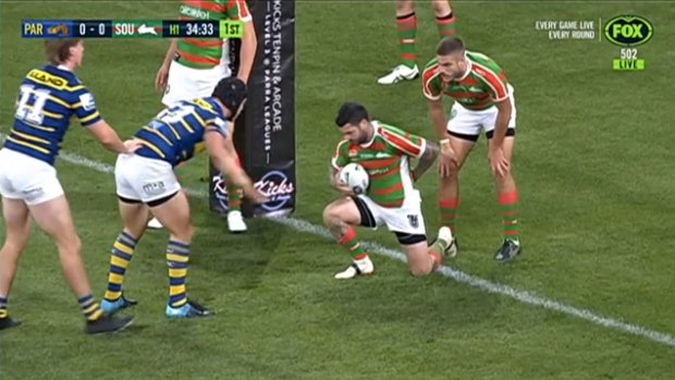 Rabbitohs halfback Adam Reynolds gets up after suffering a fractured back in the 6th minute of the Eels clash.