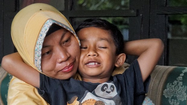 Baiq Nuril Maknun and her youngest son, seven-year-old Rafi.