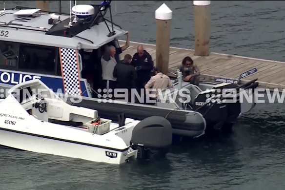 Police at the Geordie Bay jetty at Rottnest Island where a man has been bitten by a shark.