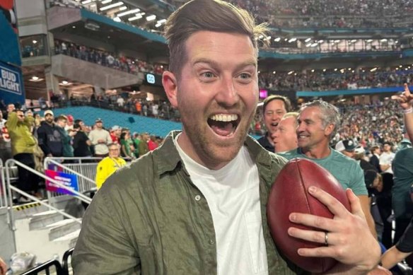 Eamonn Dixon holds the ball he caught in Arizona.