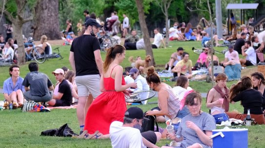 People relaxing at the Edinburgh Gardens in Fitzroy.
