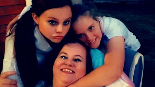 Belinda Finlay (below) with her two young daughters Merlinda (left) and Mackye (right).