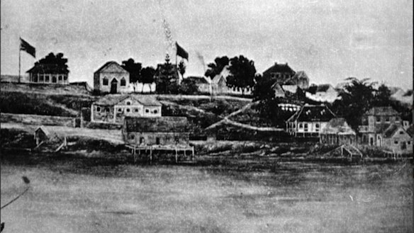 Brisbane's Queen's Wharf Road and the wharf in the 1860s. Some of the city's earliest pubs, The Green Man and the Queens Head Inn feature.