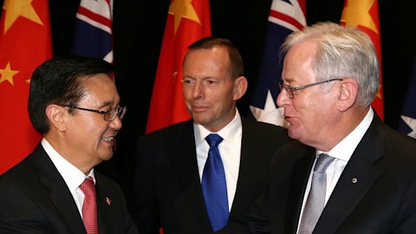 Chinese Commerce Minister Gao Hucheng, former prime minister Tony Abbott and then trade minister Andrew Robb at the signing of the China-Australia Free Trade Agreement in June 2015. 
