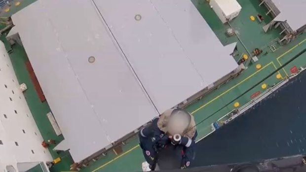 A man was winched from a cargo ship on Friday after he was hit by a large pulley.