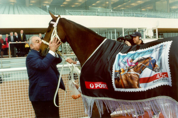 Nick Moraitis with his champion Might And Power at the launch of a Champions of the Turf stamp.