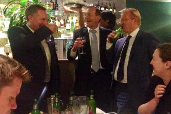 Paul Whittaker (right), then-Daily Telegraph editor, with Tony Abbott and  Simon Benson at a 2014 dinner.