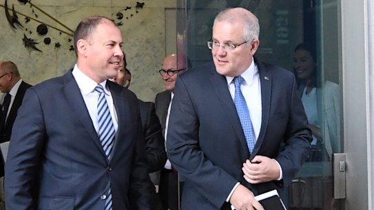 Treasurer Josh Frydenberg and Prime Minister Scott Morrison at leave the Reserve Bank after meeting governor Philip Lowe on Wednesday. 