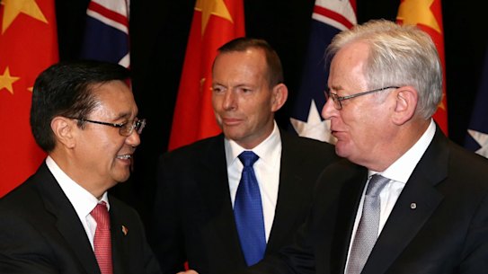 Chinese Commerce Minister Gao Hucheng, former prime minister Tony Abbott and then trade minister Andrew Robb at the signing of the China-Australia Free Trade Agreement in June 2015. 