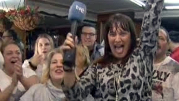 Spanish reporter Natalia Escudero celebrates her El Gordo win on live TV.
