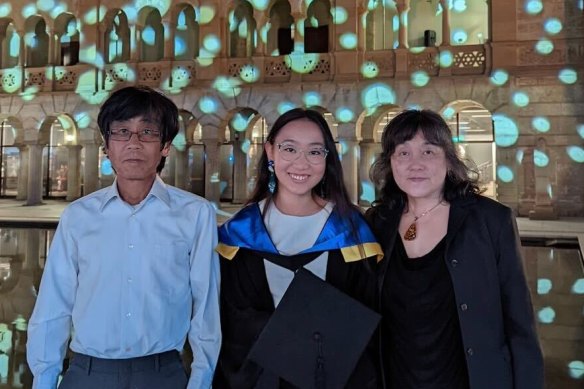 Millie Muroi, her dad Michihito and mum Riyoko, at her University of Western Australia graduation in 2021.