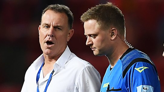 Mariners coach Alen Stajcic speaks with referee Adam Fielding after the full-time whistle on Friday.