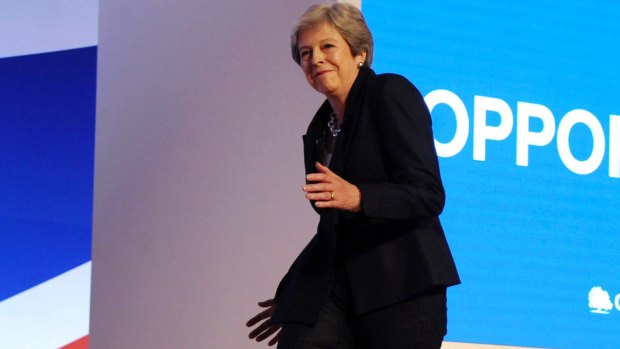 Theresa May dances as she arrives on stage at the Conservative Party conference in October.