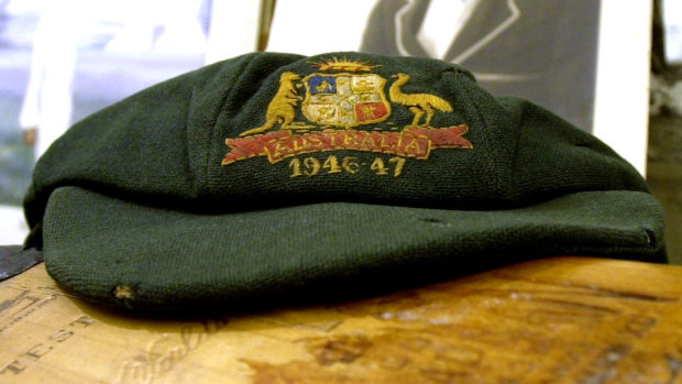 A baggy green cap which belonged to cricketing legend Sir Donald Bradman.