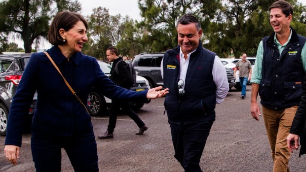 Victors despite several  scandals ... Premier Gladys Berejiklian and Deputy Premier John Barilaro in Muswellbrook on Saturday, election day, with the winning Nationals candidate Dave Layzell. 
