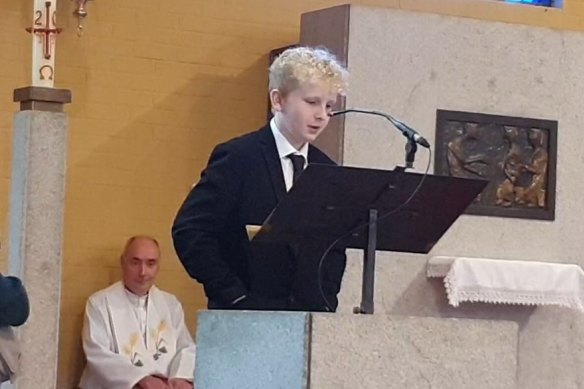Hamish O’Flaherty, 12, pays tribute to his father, James.