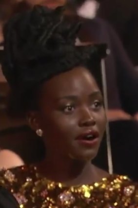 Lupita Nyong’o reacts after Will Smith appeared to strike Chris Rock at the Academy Awards.