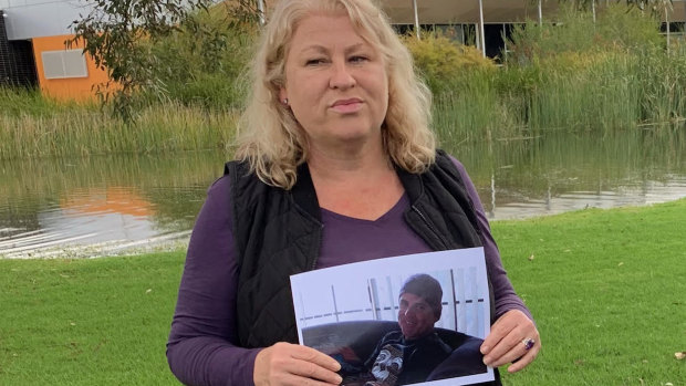 Leith Masters holds a picture of her missing brother.