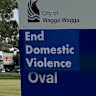 A poster with the words “End Domestic Violence” was anonymously plastered on top of the sign in March.
