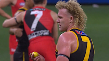 A confused Reuben Ginbey picks up the lemon that was thrown at him.