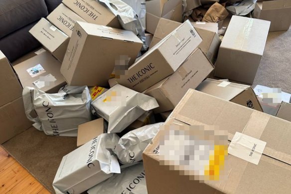 Boxes of clothing that scammers claimed on Telegram they had bought on other people’s accounts. 