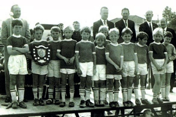 A young Arnold (second from left) with a trophy and his Under 7 Gwawley Bay team.