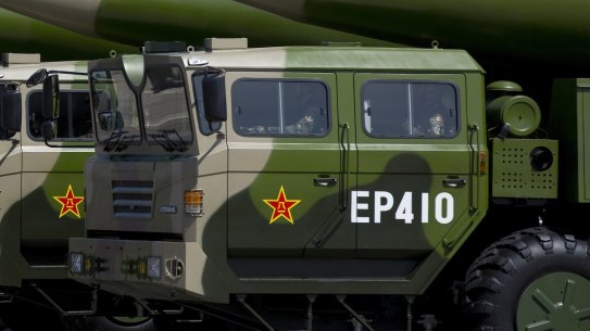 Military vehicles carrying DF-26 ballistic missiles, drive past Tiananmen Gate during a military parade in Beijing to commemorate the 70th anniversary of the end of World War II.