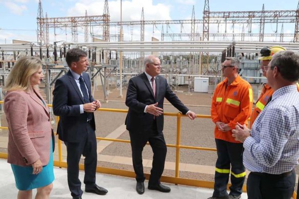 Prime Minister Scott Morrison (centre) visits the Tomago aluminium smelter near Newcastle with Angus Taylor, the Minister for Energy and Emissions Reduction (second from left), in September.