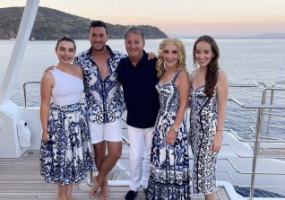 They didn't get it at Lowes.  Retail heiress Linda Penn (second from right) with her extended family dressed in Dolce & Gabbana in Corsica this week.