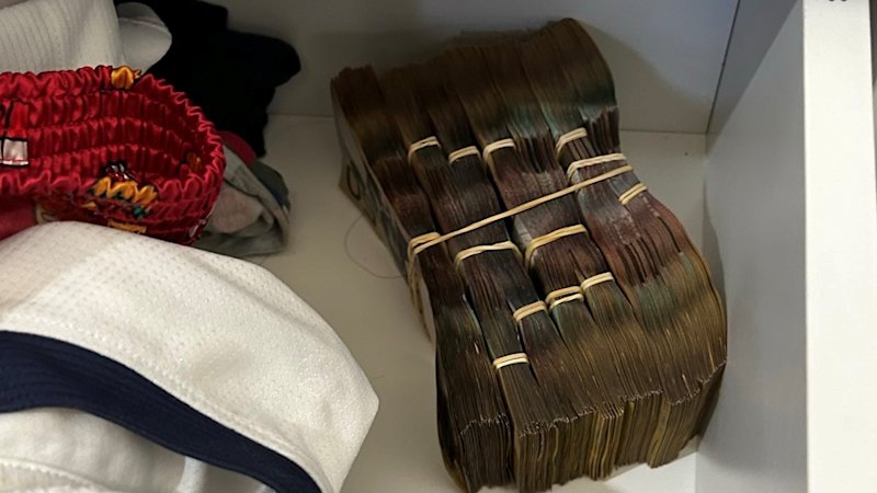 Bundles of cash allegedly found in underwear drawer of man accused of $3.5m fraud