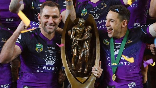 Cameron Smith (left) and Billy Slater enjoy last year's Storm triumph.