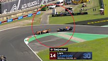 Oscar Piastri impeding Liam Lawson.