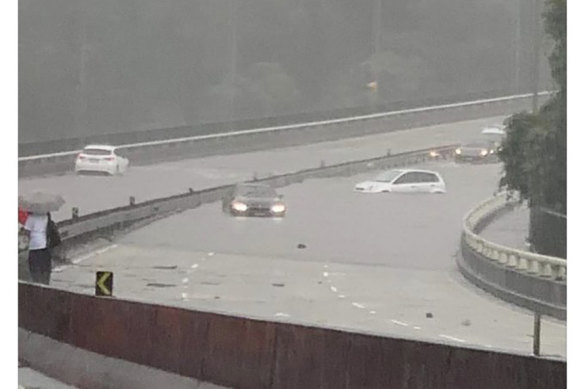 Cars stuck in flood water on Sydney’s Roseville bridge on Tuesday.