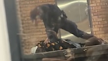 The footage posted to social media showed the police officer at Cabramatta train station striking a man he had pinned to the ground.