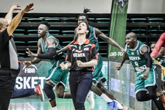 “Coach Liz” celebrates a memorable victory for Kenya.