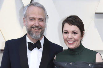 Olivia Colman and her husband Ed Sinclair arrive at the Oscars in February 2019. 