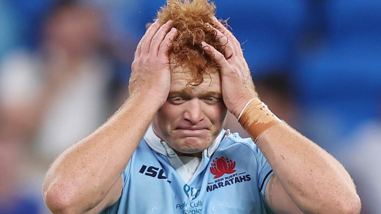 Tane Edmed of the Waratahs reacts after missing a penalty goal to win the match during the round three Super Rugby Pacific match between NSW Waratahs and Highlanders at Allianz Stadium