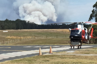 The first "watch and act" bushfire of the season in the state's north closed the Pacific Motorway on Monday.