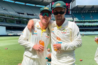 Marcus Harris and Travis Head arm-in-arm after the Boxing Day Test.
