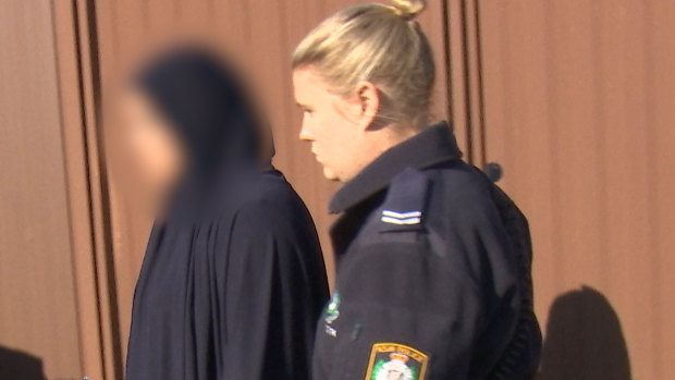 The woman, arrested on Thursday, has been charged with 12 fraud-related offences.