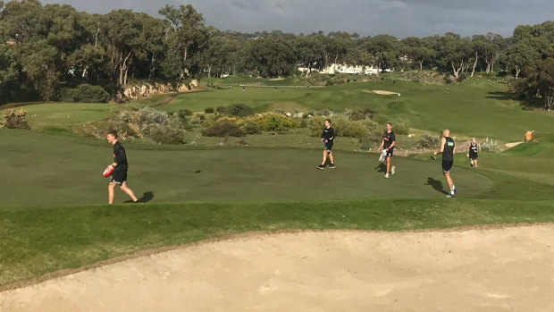 Collingwood players cross the 4th hole of the Dunes course at Joondalup Resort. Picture: Collingwood Football Club