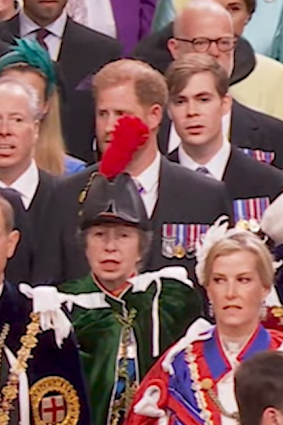 Prince Harry is obscured by Princes Anne’s hat at Westminster Abbey.