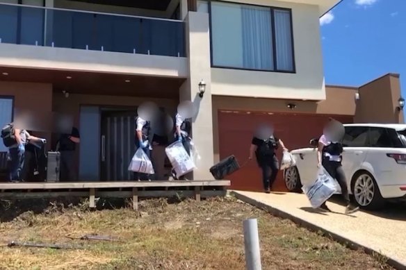 AFP officers raiding properties as part of the investigation that was later dropped.