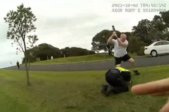 Steven Cleary uses a metal baseball bat to strike Senior Constable Rowan Baldam.