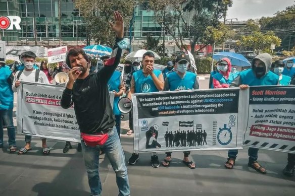 Refugee leader Ezat Ahmadi fronts a peaceful protest in Indonesia.