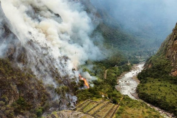 Firefighters battle a bushfire encroaching on Machu Picchu area  ruins in Peru on Thursday.