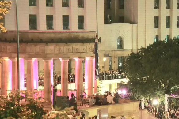 The Shrine of Remembrance and Eternal Flame during an Anzac Day Dawn Service in Brisbane.